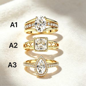 May include: Three gold rings labeled A1, A2, and A3. A1 features an oval center stone with side accents. A2 has a square center stone and an openwork band. A3 displays a pear-shaped center stone surrounded by a halo of small stones on the band.