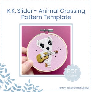 Puede incluir: Un bastidor de bordado con un personaje de perro blanco tocando la guitarra sobre un fondo rosa, con notas musicales. El texto dice "K.K. Slider - Animal Crossing Pattern Template". Hay un patrón PDF disponible.