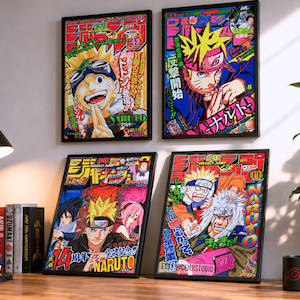 May include: Four framed Naruto manga art prints with vibrant colors and Japanese text. The prints feature characters from the anime series. A black mug with a red spiral design sits on a wooden desk, alongside books and a figurine.