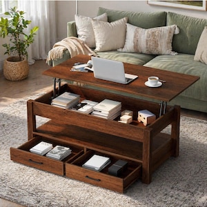 May include: A dark brown lift-top coffee table with two pull-out drawers. The table is open, revealing storage space with books and decorative items. A laptop and coffee cup sit on the tabletop. The table is in a living room setting.