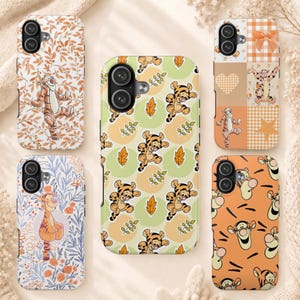 May include: Five rectangular phone cases featuring Tigger from Winnie the Pooh. Designs include orange leaf patterns, a green and yellow polka dot background with leaves, a checkered grid with a bow and heart, floral motifs, and a Tigger face pattern.
