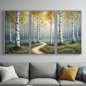 Peut inclure: Un ensemble de trois tableaux muraux représentant une forêt de bouleaux blancs aux marques noires. La scène montre un chemin de terre sinueux à travers une prairie herbeuse parsemée de petites fleurs jaunes sous un ciel lumineux et doré.