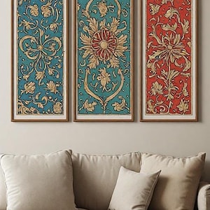 May include: Three rectangular wall art panels in wooden frames. The two outer panels feature a teal background with gold floral patterns, while the center panel displays a red background with gold floral patterns, all showcasing intricate botanical motifs.