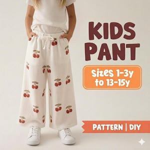 May include: Cream-coloured kids' trousers with a cherry pattern. The trousers have a wide leg design and a drawstring waist. The image also includes the text "KIDS PANT" and "SIZES 1-3y to 13-15y". The trousers are paired with white trainers.