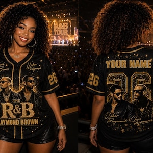 May include: Black baseball jersey with gold accents, featuring the text "THE R&B RAYMOND BROWN" and images of two musicians. The jersey has the number 26 on the sleeves and back, with "YOUR NAME" above the number.