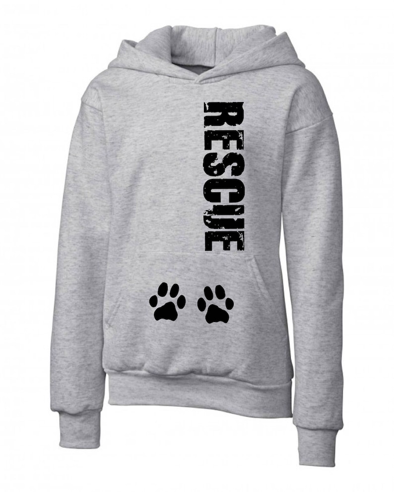 May include: A gray hooded sweatshirt with the word "RESCUE" printed vertically down the front in black. Two black paw prints are printed below the word.