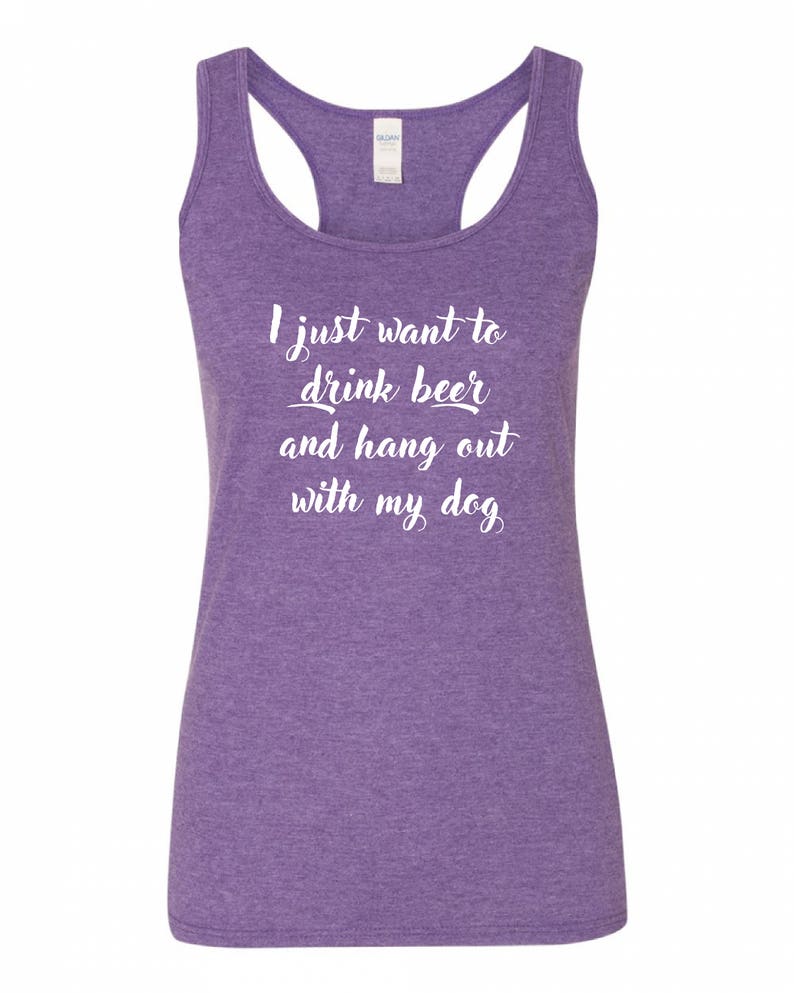 May include: Purple racerback tank top with the text "I just want to drink beer and hang out with my dog" in white.