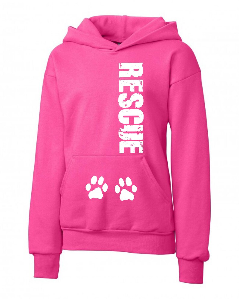 May include: Pink hooded sweatshirt with the word "RESCUE" printed vertically in white on the front and two white paw prints on the front pocket.