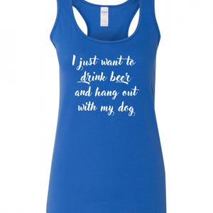 May include: A royal blue racerback tank top with the text "I just want to drink beer and hang out with my dog" in white.