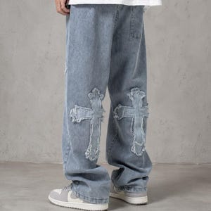 y2k jeans, baggy denim, cross jeans, streetwear pants, oversized jeans, grunge clothing, skater jeans, vintage denim, gothic jeans, wide leg jeans, unisex clothing, hip hop fashion, patchwork jeans