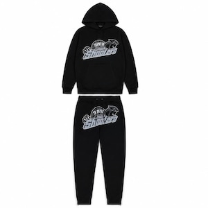 May include: Black hoodie and sweatpants set. The hoodie has a drawstring hood and a front pocket. Both pieces feature a logo with the text "TAPPTA LONDON SHOOTERS" and a panther graphic in white and gray.