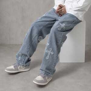 y2k jeans, baggy denim, cross jeans, streetwear pants, oversized jeans, grunge clothing, skater jeans, vintage denim, gothic jeans, wide leg jeans, unisex clothing, hip hop fashion, patchwork jeans