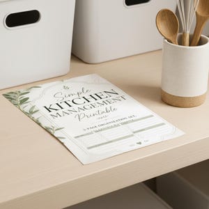 May include: A white paper sheet titled Simple KITCHEN MANAGEMENT Printable, featuring a 5-page organization set with green leaf illustrations, decorative borders, and structured fields for tracking kitchen inventory and meal planning tasks.