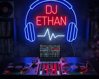 May include: A neon sign featuring a blue outline of headphones and a white sound wave graphic with the red text DJ ETHAN. The sign is mounted above a DJ setup consisting of two turntables, a central audio mixer, and an open laptop computer.