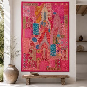 May include: A large rectangular wall hanging featuring a vibrant patchwork design in shades of hot pink, magenta, teal, and gold. The textile displays intricate embroidered patterns, floral motifs, and paisley shapes arranged in a vertical composition.