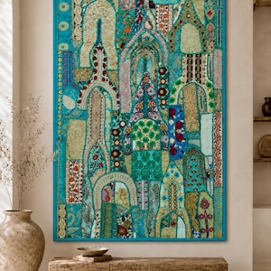 May include: A large rectangular wall hanging featuring a vibrant turquoise patchwork design. The textile art displays intricate embroidered patterns, floral motifs, and arched architectural shapes in shades of gold, red, and green.