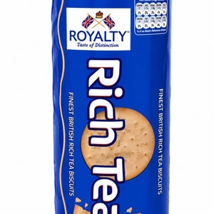 May include: A cylindrical blue package of Royalty Rich Tea biscuits. The label features the text Royalty Taste of Distinction, two crossed British flags, and a nutritional information table. The package displays a 300g weight and biscuit images.