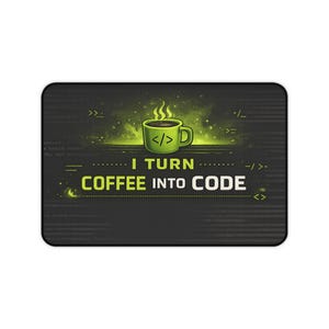 May include: A black rectangular mousepad with a green coffee cup graphic and the text "I TURN COFFEE INTO CODE." The coffee cup has the code symbol and steam rising from it. The background is dark with green accents.