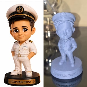 May include: A custom bobblehead figure of a captain wearing a white uniform with gold accents and a matching hat with an anchor emblem. The base is black with a gold plaque reading CAPTAIN TONY. A second unpainted grey version is also shown.