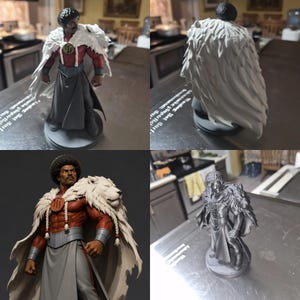 May include: A collectible figurine of a muscular character with an afro hairstyle, wearing a red chest piece with a circular emblem, a grey skirt, and a white lion pelt draped over the shoulders. The figure stands on a circular base.
