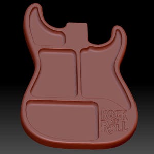 May include: A brown guitar-shaped tray with three distinct recessed compartments. The tray features a smooth, rounded edge and the text "ROCK & ROLL" is embossed in the lower right section, providing a clear visual representation of the design.