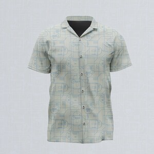 Può includere: Una camicia a maniche corte con abbottonatura in color beige chiaro caratterizzata da un motivo geometrico ripetitivo di sottili linee blu. La camicia presenta un colletto classico, un'abbottonatura frontale con bottoni beige e una fodera scura.