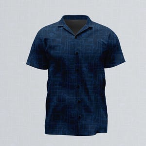 May include: A short-sleeve button-down shirt in a deep navy blue color featuring a repeating geometric line pattern in a lighter shade of blue. The shirt has a classic collar, a front button placket, and a structured fit with short sleeves.