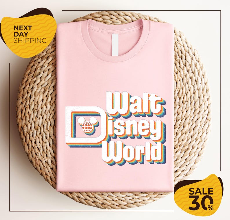 A pink t-shirt with the text "Walt Disney World" printed on it, placed on a woven basket. There are two yellow sale signs in the image, one on the left and one on the right, indicating a 30% discount on the item.