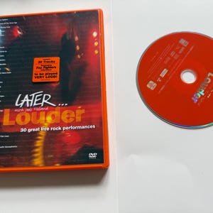 May include: A Later... with Jools Holland Louder DVD case and matching orange disc. The cover features a tracklist, a red sticker stating 30 Tracks Exclusive Foo Fighters interview to be played VERY LOUD!, and the BBC logo at the bottom.