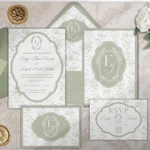 May include: A sage green and white wedding stationery set featuring floral patterns, ornate frames, and monogrammed initials. The invitation includes text for Emily Anne Cassidy and Joseph Scott Ricker, with an RSVP card and matching envelopes.