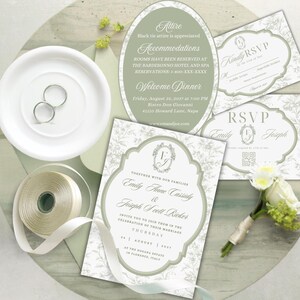 May include: A wedding invitation suite featuring sage green and white floral patterns, including a main invitation, RSVP cards, and an oval information card. The set is accompanied by two silver rings, a spool of cream ribbon, and a small white floral boutonniere.