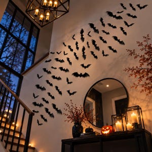 May include: A collection of black bat-shaped wall decals arranged in a swarm pattern on a white wall. The display includes numerous individual bat silhouettes of varying sizes, creating a dynamic visual effect across the interior wall surface.