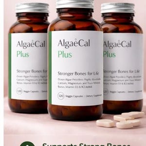 May include: Three brown supplement bottles with white labels, silver lids, and the text "AlgaeCal Plus." The bottles are labeled "Stronger Bones for Life" and "120 Veggie Capsules." The image also includes the text "Pack of 3," and "Supports Strong Bones."