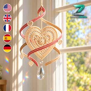 May include: A hanging crochet ornament featuring a central beige heart with intricate lace patterns, surrounded by a spiraling ribbon in beige and muted red. Small crochet hearts are attached to the ribbon, and a clear crystal teardrop hangs below.