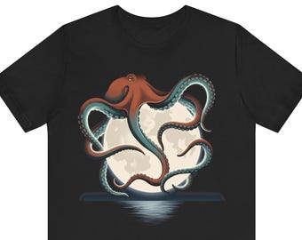 May include: A black short-sleeve t-shirt featuring a graphic print of a reddish-brown octopus with teal-colored suckers on its tentacles. The octopus is positioned in front of a large, pale yellow full moon with a dark water reflection below.