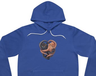May include: A royal blue hooded sweatshirt featuring a graphic print of two octopuses intertwined to form a heart shape. One octopus is dark grey and the other is light brown. The hoodie includes a front kangaroo pocket and white drawstrings.
