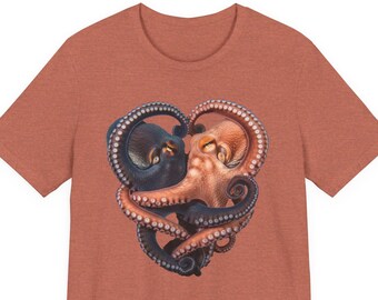 May include: A heathered terracotta orange short-sleeve t-shirt featuring a central graphic of two octopuses, one dark blue and one light orange, with their tentacles intertwined to form a heart shape, showcasing detailed suckers and textures.