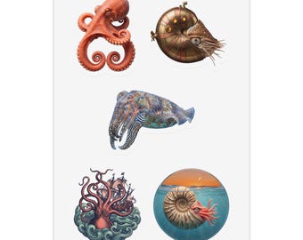May include: A sticker sheet featuring five distinct marine-themed illustrations: an orange octopus, a metallic steampunk-style nautilus, a patterned cuttlefish, a giant kraken attacking a sailing ship, and a nautilus swimming in a circular ocean scene.