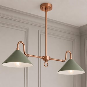 May include: A dual-light pendant fixture featuring a metallic copper finish frame with a central vertical rod and two curved arms. Each arm supports a matte sage green conical shade with a white interior, housing a single light bulb.