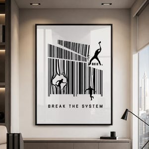 May include: A rectangular wall art print featuring a black and white graphic design of a barcode being broken by silhouettes of people. One figure swings an axe, while others emerge through tears in the lines. The text BREAK THE SYSTEM is printed below.