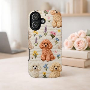 May include: A phone case featuring a cream-colored quilted pattern with embroidered poodles and floral accents. The case showcases various poodle poses, with flowers in pink, yellow, and blue. The case has a camera cutout.