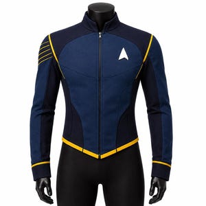 May include: A navy blue and dark blue zip-up jacket featuring a high collar, yellow piping accents along the shoulders, hem, and cuffs, and a white delta-shaped emblem on the left chest. The jacket has long sleeves and a central front zipper.