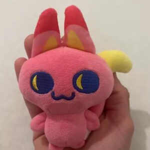 Rosa Tamagotchi Paradise plyschnyckelring | Bandai kaninfigur plysch | Kawaii samlarleksak virtuellt husdjur present 10 cm bild 2