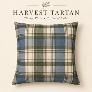 Blue and olive Harvest Tartan pillow cover featuring a classic plaid pattern in dusty blue, olive green, cream and warm brown on a neutral background.