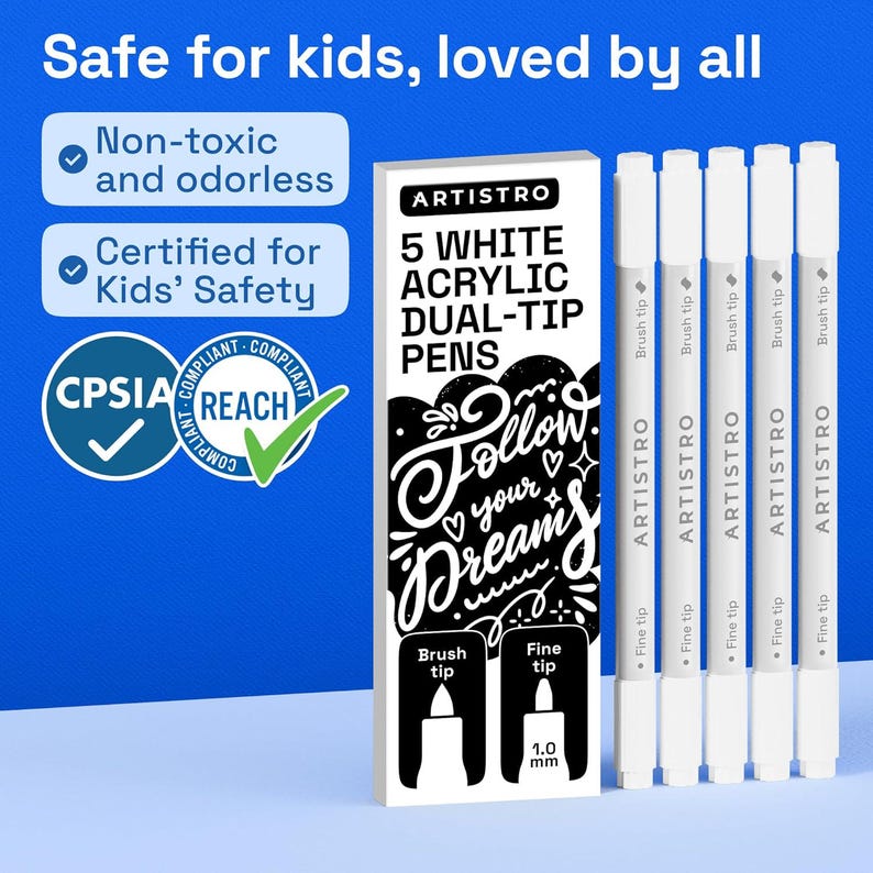 May include: A set of five white acrylic dual-tip pens by Artistro, featuring a brush tip and a 1.0 mm fine tip. The packaging displays the text 5 WHITE ACRYLIC DUAL-TIP PENS, Follow your dreams, Non-toxic and odorless, and Certified for Kids' Safety.