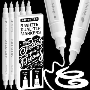 May include: Five white dual-tip markers by Artistro with a rectangular box featuring the text "5 WHITE DUAL-TIP MARKERS" and "Follow your dreams". The markers have a fine tip and a brush tip, with one marker showing a 1.0 mm fine tip label.