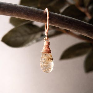 May include: A set of three ceramic mugs with a speckled, matte finish. The mugs are in shades of cream, light gray, and dark gray. Each mug has a simple, minimalist design, perfect for coffee or tea.