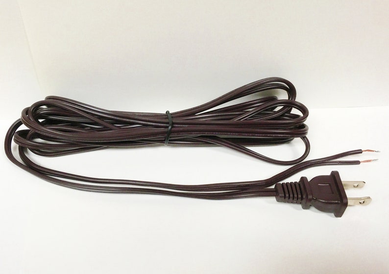 May include: A brown electrical extension cord with a two-prong plug.