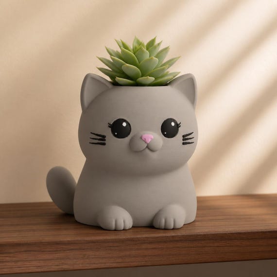 Close-up lifestyle view of the Whisker Sprout cat planter in Latte Brown