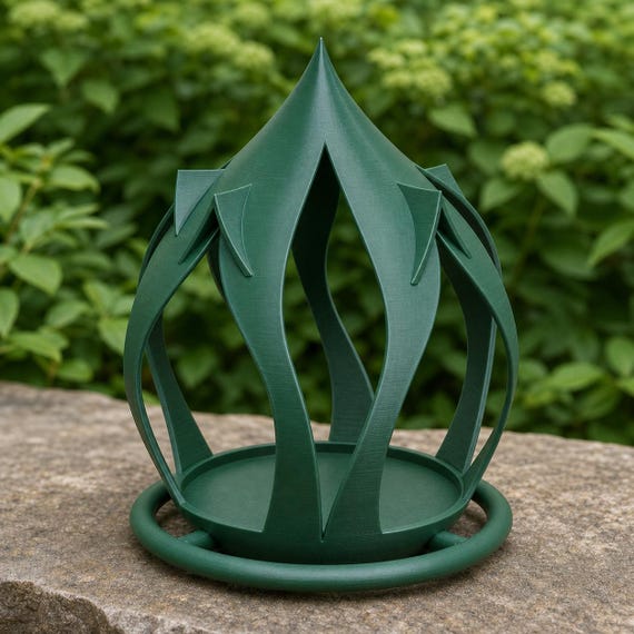 Garden angle of the Forest Green Leafspire Haven feeder and open seed platform